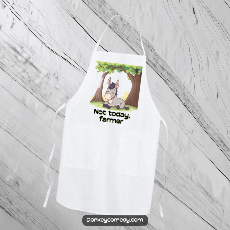 Funny donkey apron shows a donkey exhaling humorously under a tree, ideal for kitchen tasks with a side of funny relief.