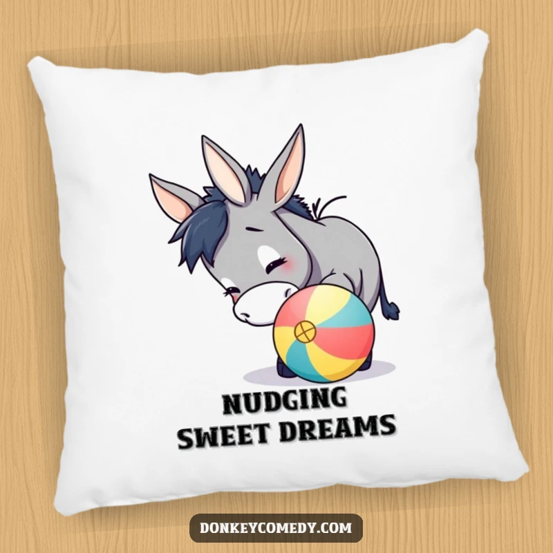 Funny donkey pillow featuring a cute, soft donkey playfully nudging a colorful ball with its nose, radiating comfort and humor.
