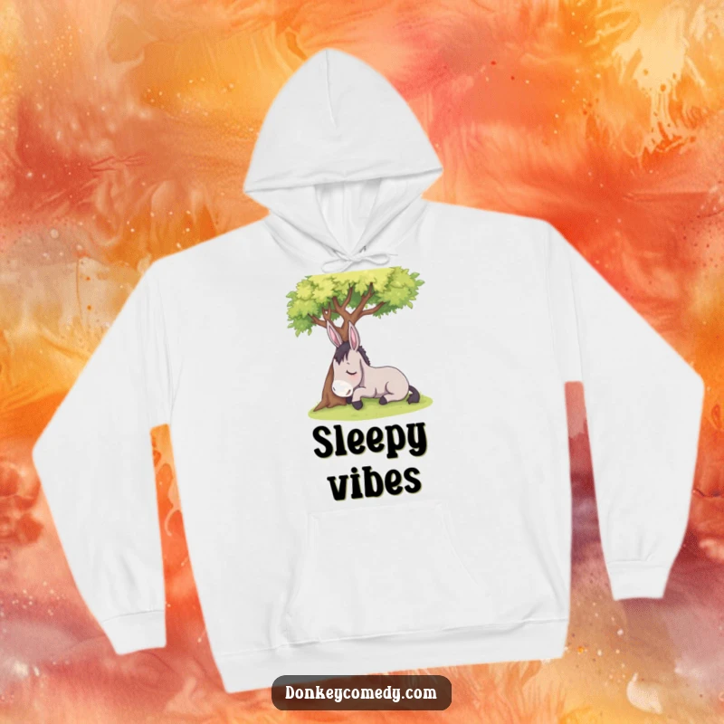 Funny sleepy donkey resting under a shady tree, featured on a warm hoodie, a humorous and comfortable gift.