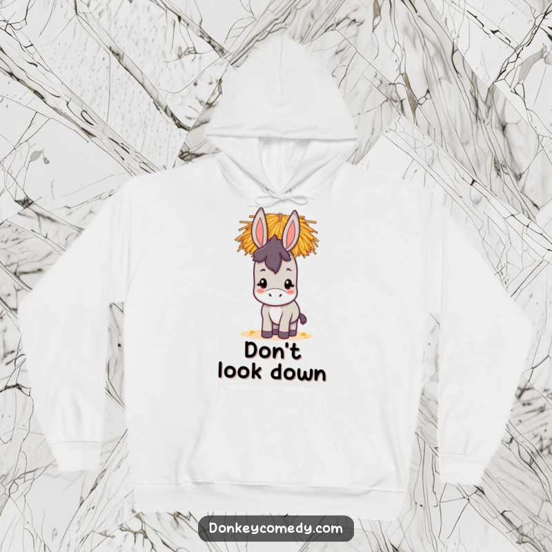 Funny kawaii donkey hoodie showing a delightful donkey with a big smile balancing a tower of hay on its head, radiating joy.