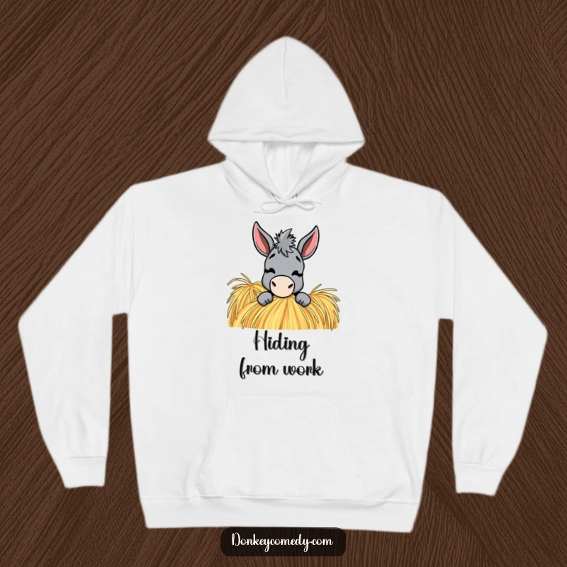 Funny Donkey Hoodie: A donkey peeks from a haystack, giving a playful wink, bringing warmth and humor.