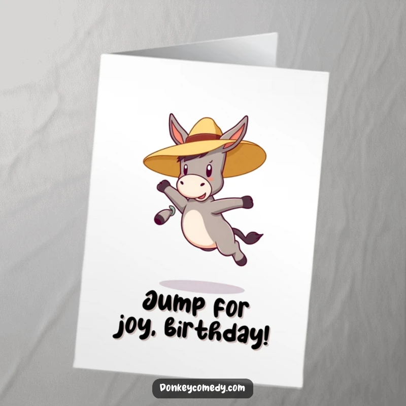 Funny Free Printable Birthday Card: A bouncy donkey leaps joyfully wearing a straw hat, celebrating a fun-filled birthday.
