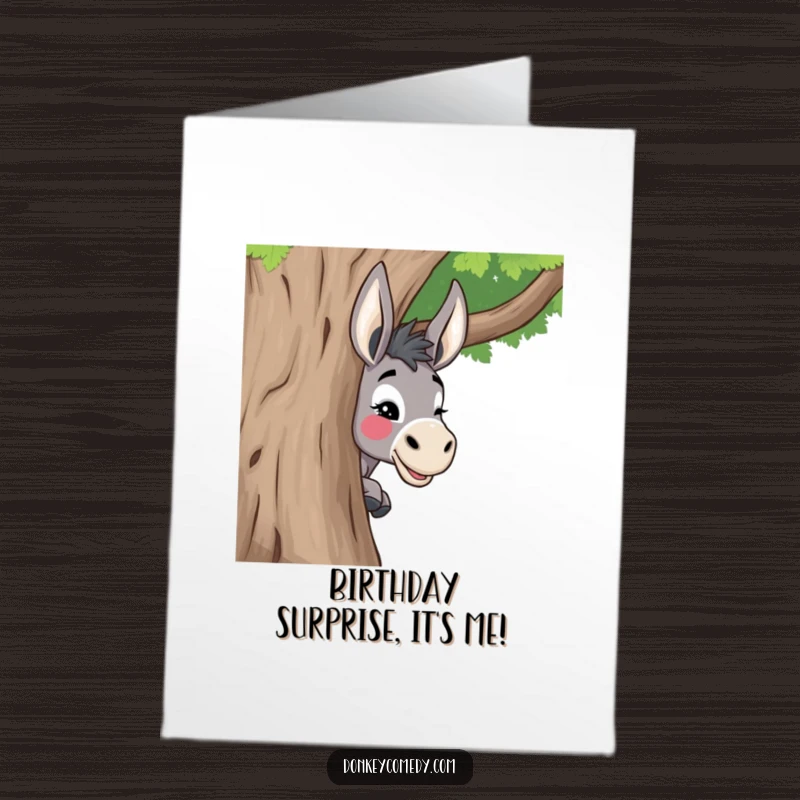 Funny Free Printable Birthday Card: A donkey playfully peeking around a tree with a mischievous wink.