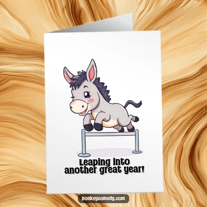 Funny free printable birthday card depicting a donkey joyfully leaping over a small hurdle, symbolizing overcoming challenges.