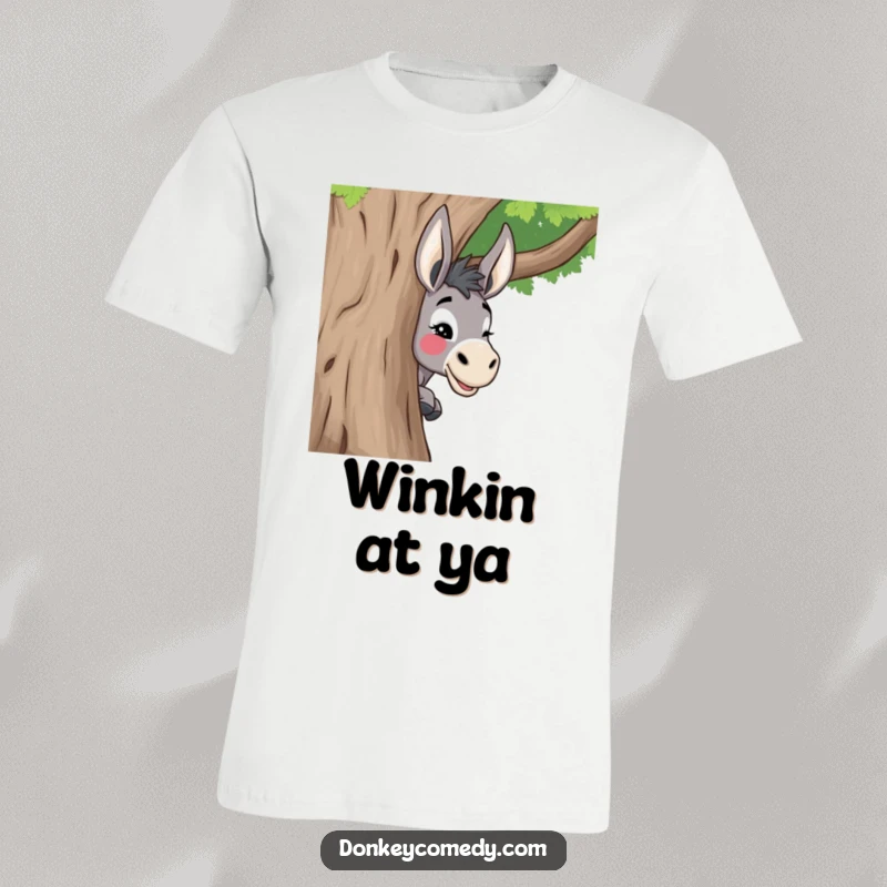 Funny donkey t-shirt featuring a donkey playfully peeking around a tree with a mischievous wink, perfect for playful souls.